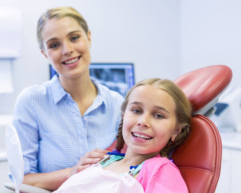 mom and daughter waiting for dentist